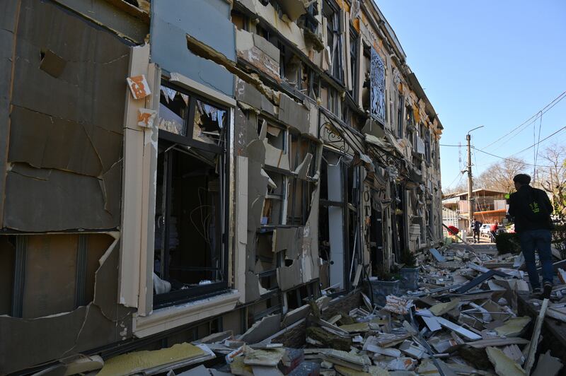 A person walks near residential houses damaged by a Russian strike in Odesa. Photograph: Michael Shtekel/AP
