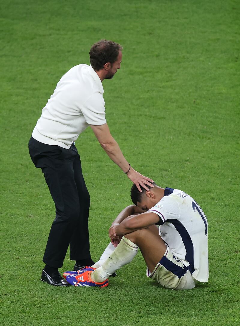 BERLIN, GERMANY - JULY 14: Gareth Southgate, Head Coach of England, consoles Jude Bellingham of England after defeat to Spain in the UEFA EURO 2024 final match between Spain and England at Olympiastadion on July 14, 2024 in Berlin, Germany. (Photo by Alex Grimm/Getty Images)