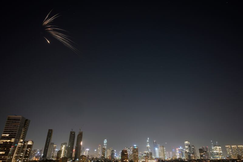Missiles launched from Iran streak across the sky over central Israel. Photograph: Ohad Zwigenberg/AP
