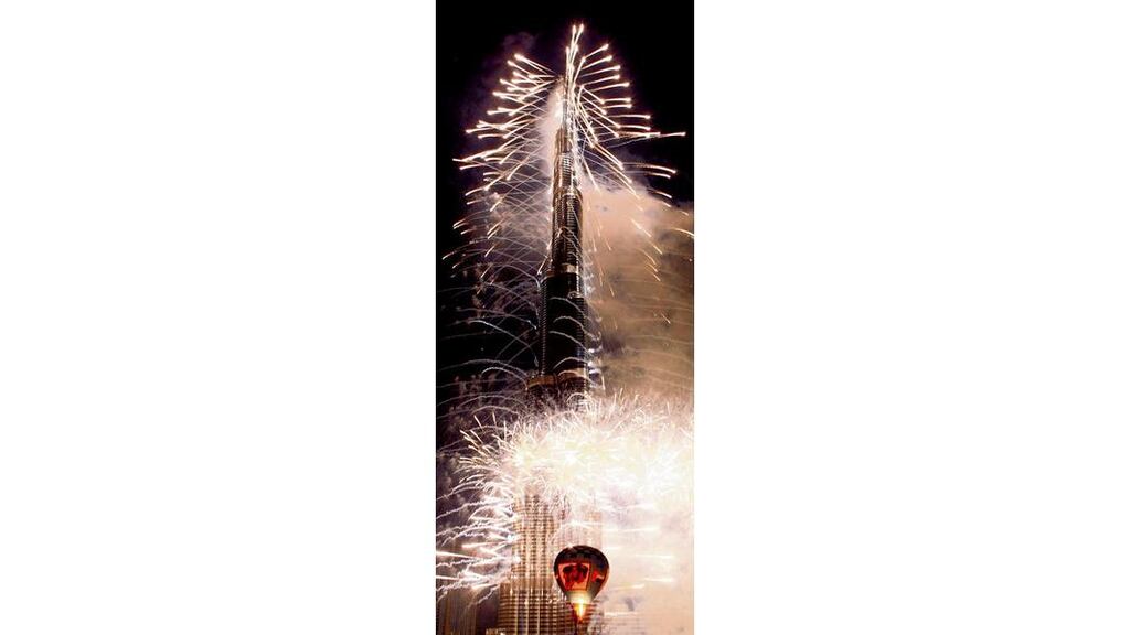 UP IN SMOKE Fireworks launch Burj Khalifa. Photograph: Martin Rose/Getty
