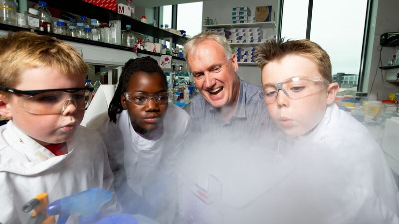 Great experiments: Prof Luke O’Neill with Elisa Mac Gabhann (11), Sennan (8) and Cillian Cummins (10) at Trinity Biomedical Sciences Institute. Photograph: Tom Honan