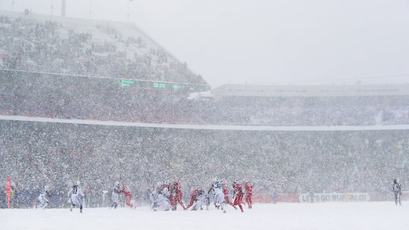 The Buffalo Bills take on the Indianapolis Colts in the snow. Photograph: Tom Szczerbowski/Getty