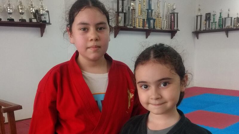 Karate kids: Kathleen and Emma Carberry Garza in Linares