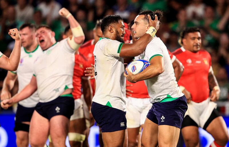 Bundee Aki congratulates James Lowe after scoring a try in the victory over Tonga in the group clash at the Stade de la Beaujoire, Nantes.  Photograph: Dan Sheridan/Inpho