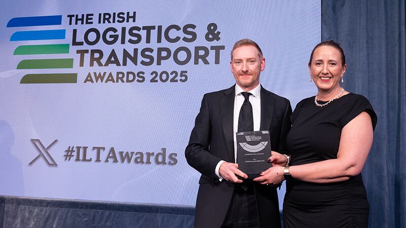 Mark Bradley, associate director at AIB Corporate Banking, presents the sustainable team of the year to Debbie Johnston, Primeline Group.