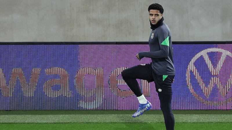 Andrew Omobamidele stretches during Ireland’s training session  at the Stade de Luxembourg ahead of the World Cup qualifier on Sunday night. Photograph: Laszlo Geczo/Inpho