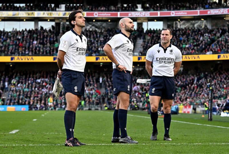 Referee Andrea Piardi (centre) and his assistant referees Gianluca Gnecchi (left) and Karl Dickson watch the TMO review which resulted in a penalty try for Wales. Photograph: Charles McQuillan/Getty Images