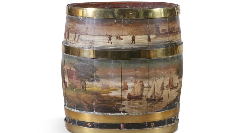 Large 19th-century brass bound oak fuel bucket painted with a Dutch winter scene, €600-€800 Adam’s