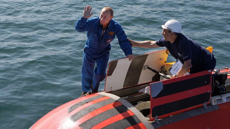 Russia’s prime minister Vladimir Putin waves after a dive into the depths of Lake Baikal in 2009. Photograph: Alexey Druzhinin/AFP via Getty