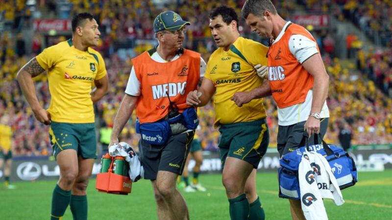 Australian  flanker George Smith  is helped of after a severe head clash with  hooker Richard Hibbard early in the third Test against the  Lions. Smith was back playing five minutes or so later.  Photograph: William West/AFP/Getty Images