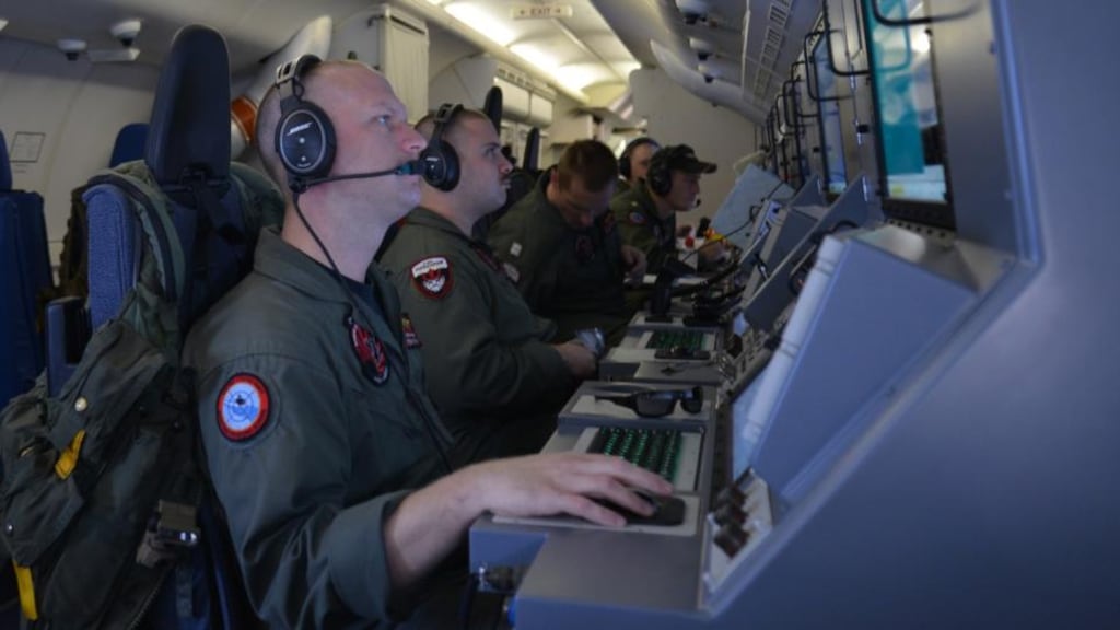 In this handout provided by the US Navy, Crew members on board a P-8A Poseidon assigned to Patrol Squadron (VP) 16 man their workstations while assisting in search and rescue operations for Malaysia Airlines flight MH370. Photograph: Eric A. Pastor/US Navy via Getty Images