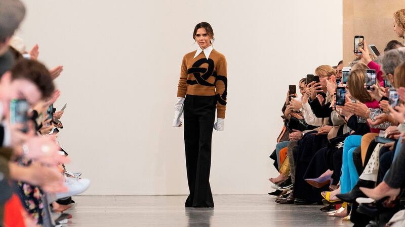 British designer Victoria Beckham acknowledges the crowd during her 2019 autumn/winter collection catwalk show at London Fashion Week. Photograph: Niklas Halle’n/AFP/Getty Images