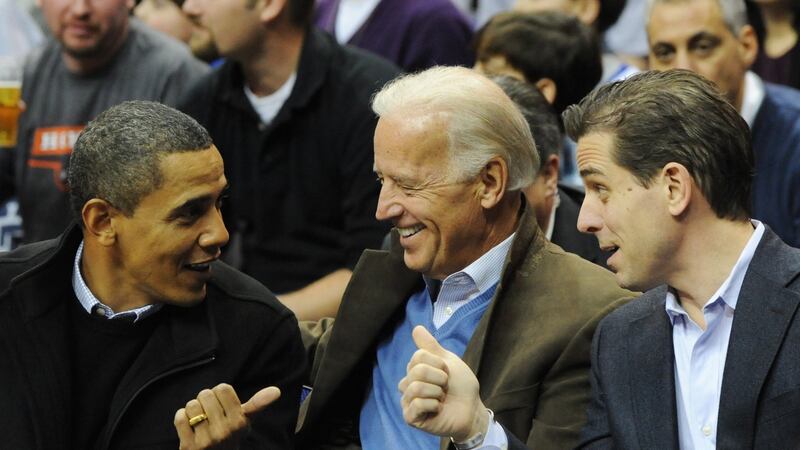 Then US president Barack Obama  greets vice president Joe Biden  and his son Hunter at a college basketball game in Washington in  January 2010. Photograph: Alexis C Glenn/EPA