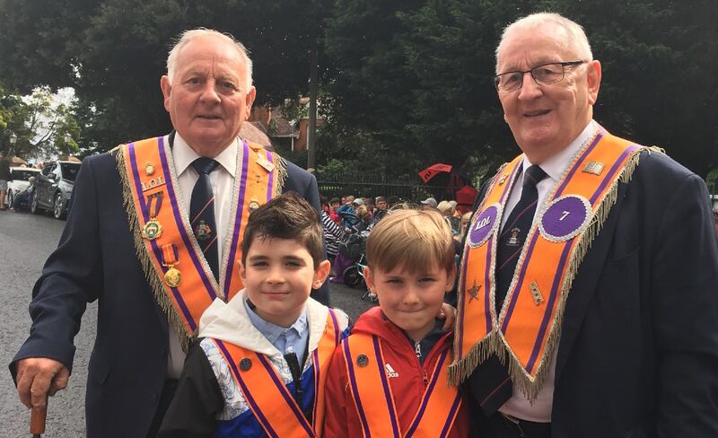 Brothers Herbie and Sydney Anderson with grandsons Eric and Harry at the Twelfth parade in Lurgan, Co Armagh
