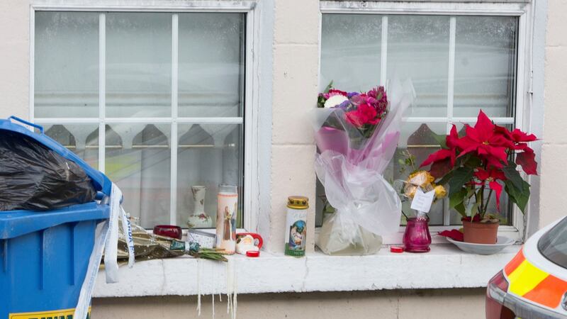 Flowers and candles on the window of Rosie Hanrahan’s  home in Thomandgate. Photograph Liam Burke/Press 22