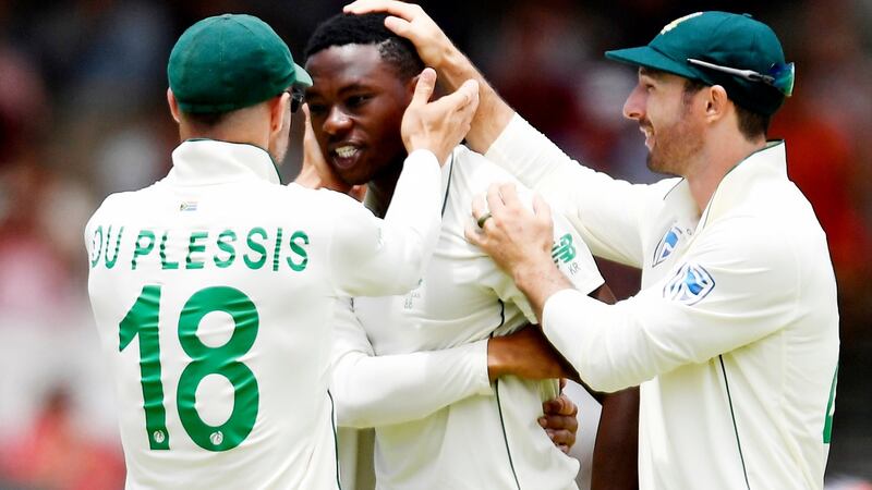 Kagiso Rabada is congratulated by South Africa captain  Faf du Plessis  after taking the wicket of Dom Sibley. Photograph: Ashley Vlotman/Gallo Images/Getty Images