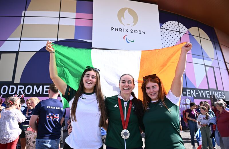 Ireland's Eve McCrystal celebrates with daughters Ava and Nessa after winning silver in the women's B 3000m individual pursuit final in Paris. Photograph: Harry Murphy/Sportsfile 