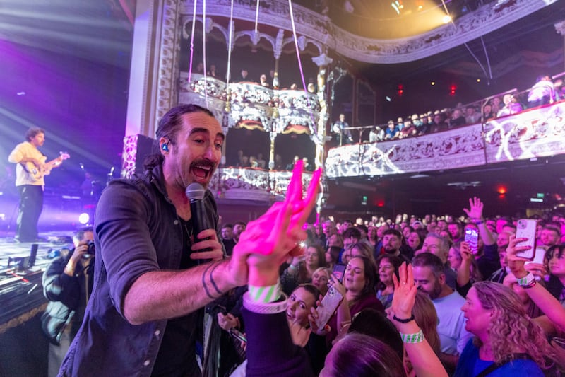 Danny O'Reilly high-fives fans at the 3Olympia Theatre, Temple Bar, Dublin
