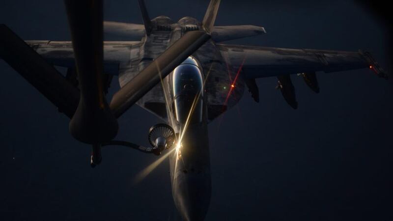 A handout picture made available by the US Department of Defense last month  shows an US fighter jet refueling from an US Air Force KC-135 Stratotanker over northern Iraq. Photograph: EPA