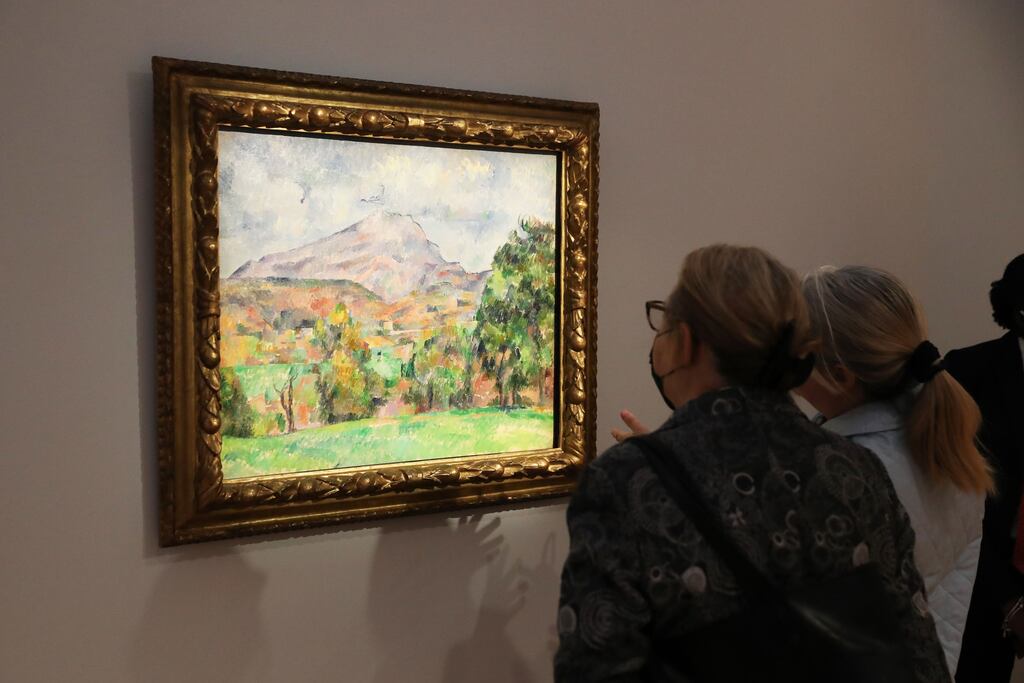 People view La Montagne Sainte-Victoire by French artist Paul Cézanne during a preview of the sale Visionary: The Collection of Paul G. Allen' at Christie's Auction House in New York. Photograph: EPA