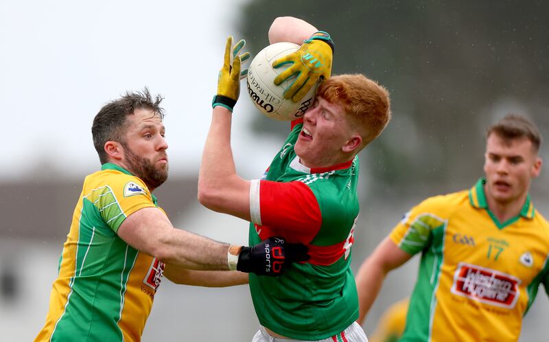 Corofin’s Conor Cunningham challenges Luke Feeney of Ballina during the AIB Connacht SFC semi-final at Pearse Stadium. Photograph: James Crombie/Inpho 