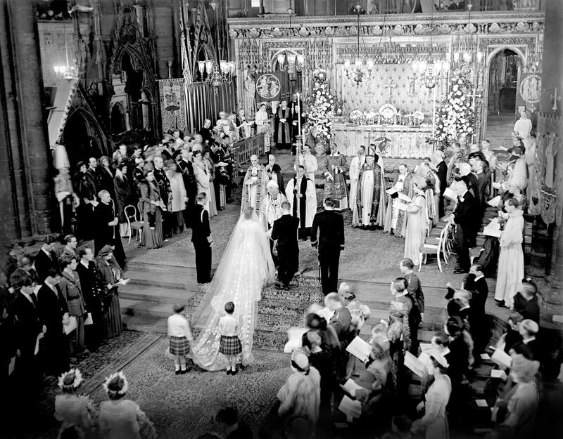 The royal wedding ceremony of Princess Elizabeth and the Duke of Edinburgh  in Westminster Abbey in1947. King George II stands to the left of the bride; on the bridegroom's right is the groomsman, the Marques of Milford Haven. The bride's train is held by two pages Prince William of Gloucester and Prince Michael of Kent. Photograph: PA