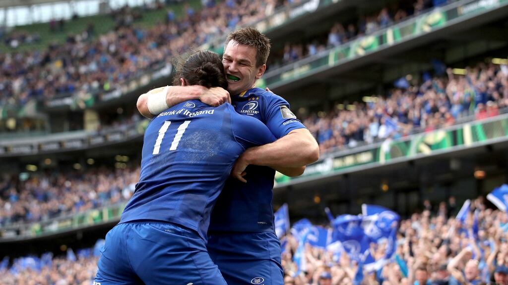 Jonathan Sexton celebrates with James Lowe after the New Zealander went over for a try in Leinster’s victory over the Scarlets in the Guinness Pro 14 final at the  Aviva Stadium. Photograph: Dan Sheridan/Inpho