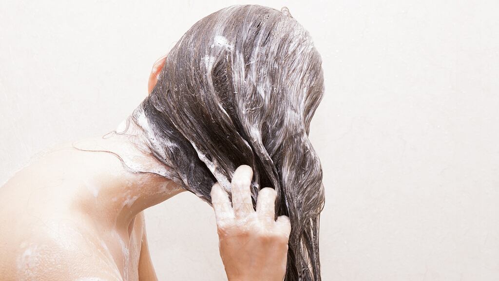 Wash the scalp rather than the hair and allow the suds to run down. Photograph: iStock