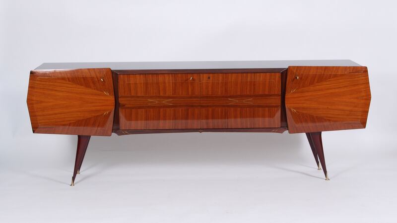 A Mid-Century Italian sideboard with black glass top supplied by Acquired.ie and recently purchased by interior designer Roisin Lafferty of Kingston Lafferty Design for an upcoming project.