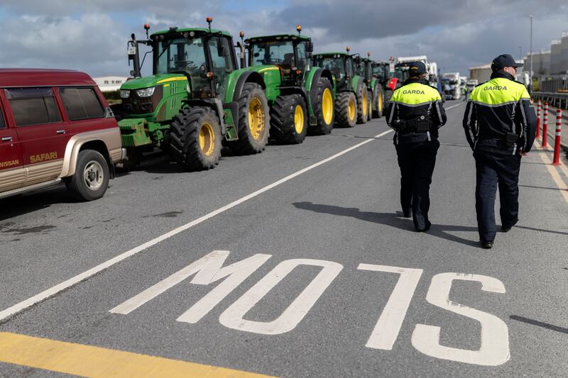 Guards watch as fuel protesters continue to block the oil depot at the port in Galway as talks continue with the government about ending the blockades. Photograph: Chris Maddaloni/The Irish Times 