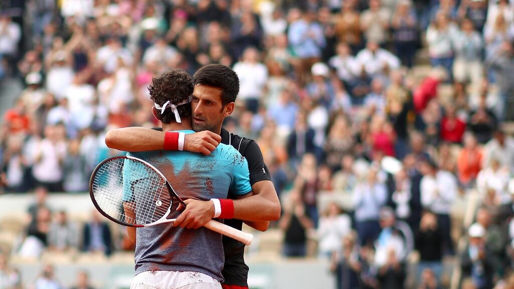 Novak Djokovic congratulates Marco Cecchinato on victory in their men’s singles quarter finals match during day ten of the 2018 French Open at Roland Garros. Photo: Cameron Spencer/Getty Images