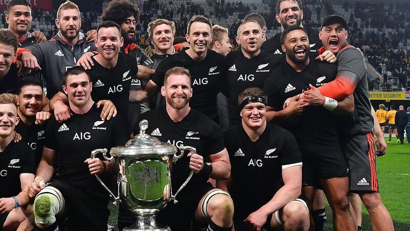 New Zealand’s captain Kieran Read and his team celebrate with the Bledisloe Cup. Photograph: Marty Melville/AFP