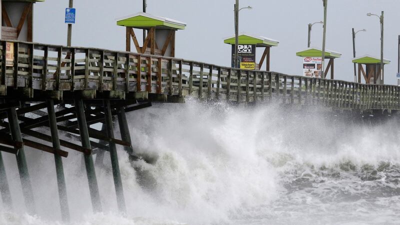 Waves from Hurricane Florence pound the Bogue Inlet Pier in Emerald Isle North Carolina on Thursday. Photograph: Tom Copeland/AP