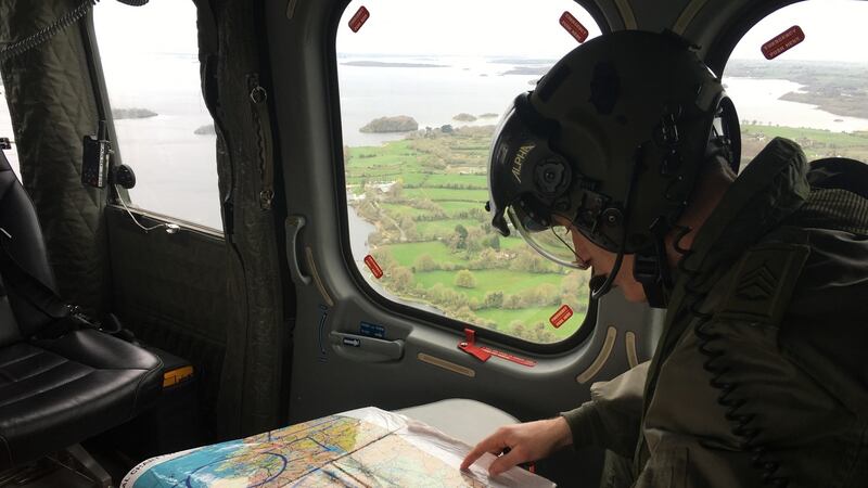 An Air Corps aviator plots a course for the EAS helicopter before it takes off from Athlone, Co Westmeath. Photograph: Peter Murtagh