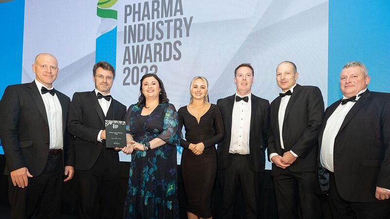 Roy Fahy, director of operations at Unispace Life Sciences Cork, presents the pharma project of the year – large award to Janssen Sciences Ireland team