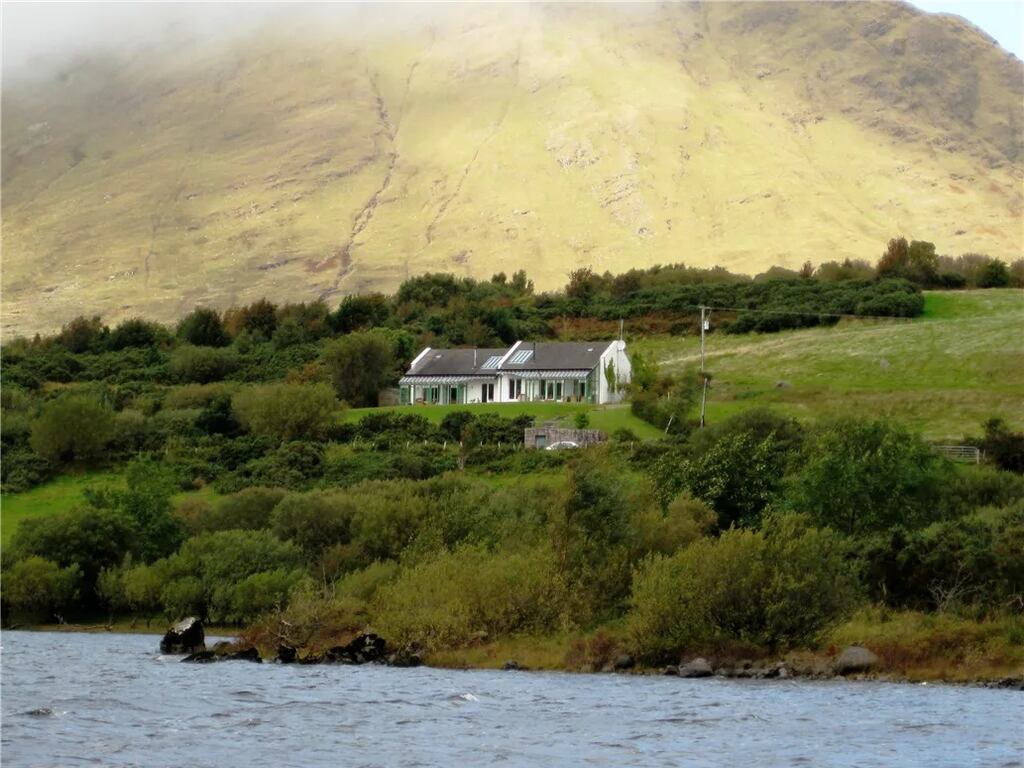This 269sq m house can be divided in two as it has two kitchens, two conservatories and four bedrooms