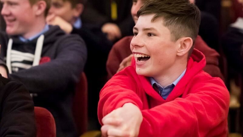 Robert Coffey from St Aidens CBS tries out one of the hand puzzles as he listens to James Tanton talking about maths at the RDS.   Photograph: John T Ohle