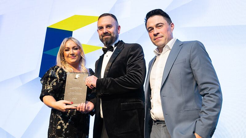 Paul Tighe, urbanism director, Ethos Engineering, presents the Excellence in Design Collaboration award to Aisling Wilson, Ash Wilson Design, and Adam Gibney, Edge Design and Construction.