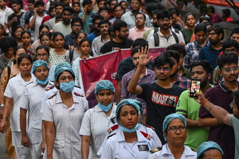 Medical professionals and students participate in a silent march as they condemn the rape and murder of a doctor in Kolkata on August 15th. Photograph: Digyangshu Sarkar/AFP via Getty Images