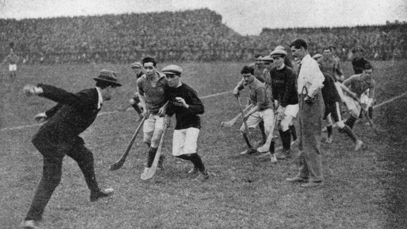 Michael Collins throws in the ball to start a hurling match at Croke Park, Dublin.  Photograph:  Hogan/Hulton Archive/ Getty Images
