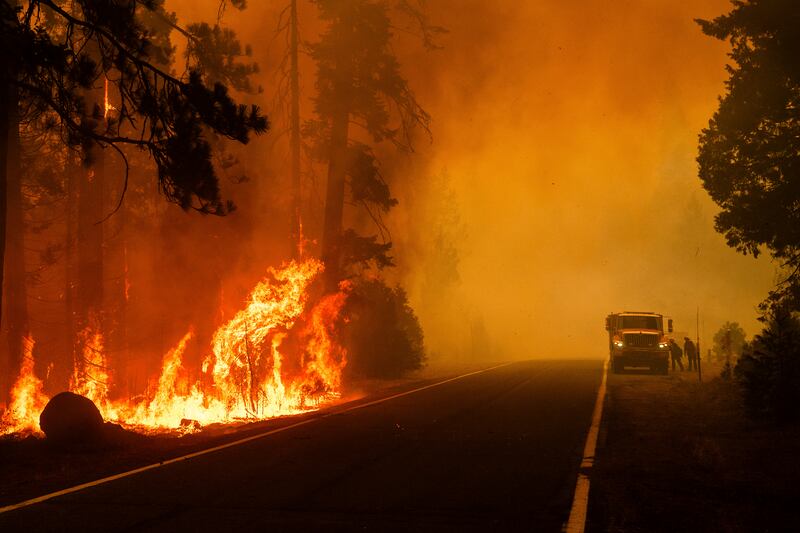 Firefighters are also tackling huge blazes in California. Photograph: AP