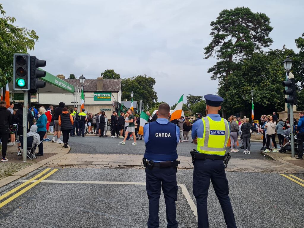 Members of An Garda Síochána observe the protest in Ballybrack, Dublin, on July 19th. Photograph: Kitty Holland