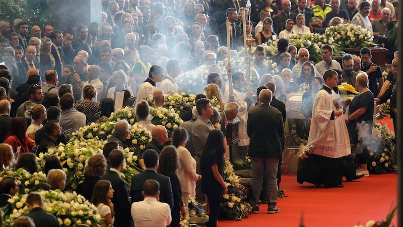 A funeral service for victims of the  collapsed highway bridge, in Genoa’s exhibition centre. Photograph: AP