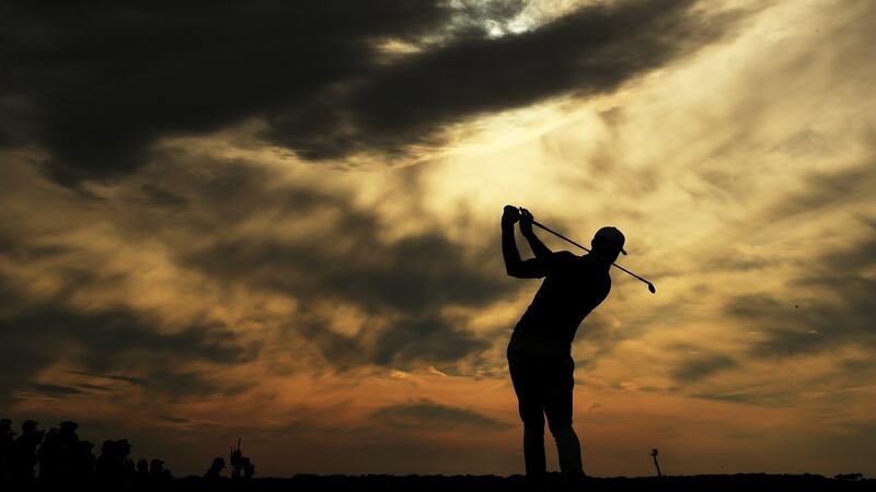 Johnson plays his shot from the 15th tee. Photo: Andrew Redington/Getty Images