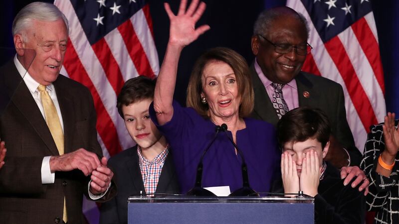 Nancy Pelosi’s grandson Paul covers his eyes as he and his brother Thomas join their grandmother in Washington as she celebrates the Democrats’ success in winning a majority in the House of Representatives in the US midterm elections. Photograph: Jonathan Ernst/Reuters
