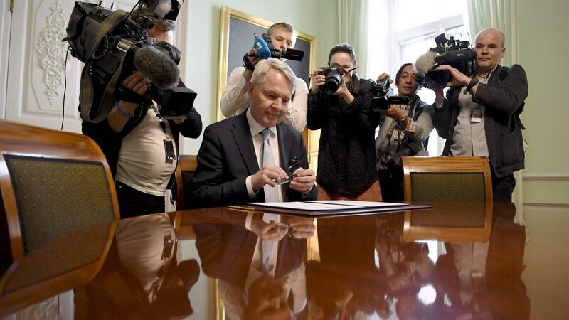 Finnish foreign minister Pekka Haavisto signs a petition for Nato membership  in Helsinki. Photograph: Antti Aimo-Koivisto/ Lehtikuva/ AFP via Getty