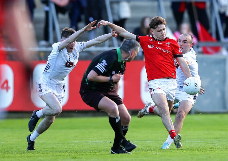 Referee Seamus Farrelly dodges a shot from Louth's Adam Gillespie. Photograph: Tom O’Hanlon/Inpho
