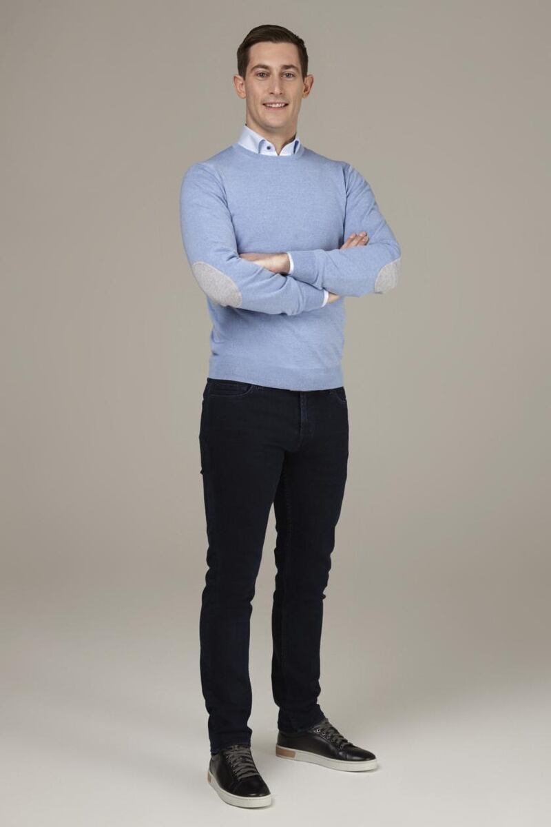 Darragh Collins  wears blue crew neck sweater €139 by Stenstroms, jeans 7 for All Mankind €249, white shirt with floral inlay €159 by Stenstroms, belt €59 Louis Copeland, and black runners Magnanni €299.
