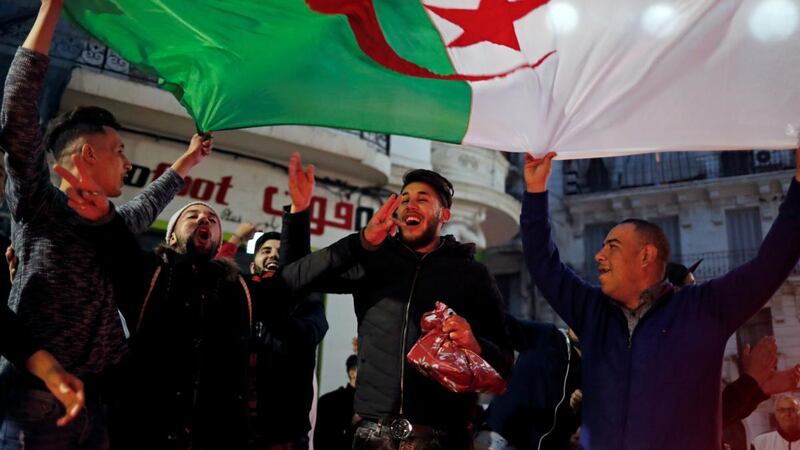 People celebrate on the streets after President Abdelaziz Bouteflika announced he will not run for a fifth term, in Algiers on Monday. Photograph: Zohra Bensemra/Reuters