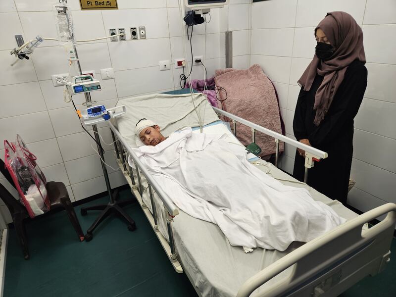Eleven-year-old Adan, the only surviving child of doctor Dr Alaa Alnajjar, lies in a bed at Nasser Hospital in Khan Younis after an Israeli airstrike hit their home. Photograph: Hani Alshaer/Anadolu